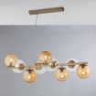 Immagine di Lampadario Da Soggiorno Looper 6 Sfere Vetro Ambra Trasparente