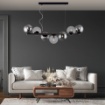 Immagine di Lampadario Orizzontale Nero Con Sfere Vetro Trasparente Fume Loop 7 Luci E14