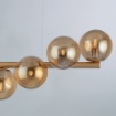 Immagine di Lampadario Oro Con Sfere Ambra 7 Luci Per Tavolo Loop Leolux