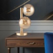 Immagine di Lampada Da Tavolo Oro Due Sfere Ambra Loop Leolux 2xE14