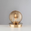 Immagine di Lumetto Oro Satinato Da Comodino Sfera Ambra Loop Leolux