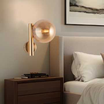 Immagine di Applique Oro Camera Da Letto Con Sfera Ambra Loop Leolux