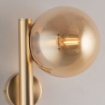 Immagine di Applique Oro Camera Da Letto Con Sfera Ambra Loop Leolux