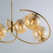 Immagine di Lampadario Archi Dorati Con 6 Sfere Ambra Per Soggiorno Ring Leo Lux