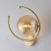 Immagine di Applique Arco Dorato Con Sfera Di Vetro Ambra Ring Leo Lux
