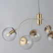 Immagine di Lampadario Da Salotto Oro Bianco Con Sfere Trasparenti Marte Leo Lux