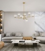 Immagine di Lampadario Soggiorno Ottone Con 9 Sfere Trasparenti Vetro Pyrex Perenz