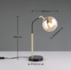 Immagine di Lampada Tavolo Ottone Nero Con Sfera Vetro Ambra Paxton Trio